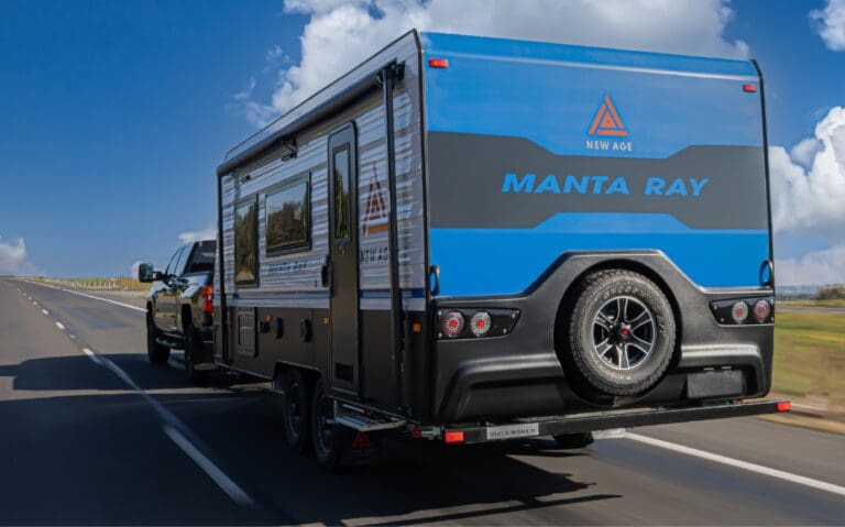 Blue caravan being pulled by a 4XD on highway